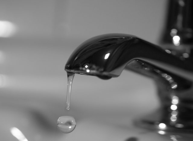 A tap with water leakage