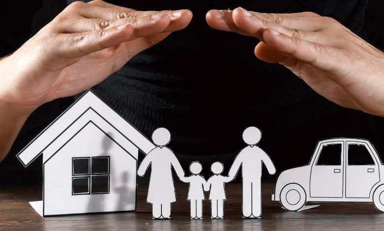 A mans hand on his family that shows that he has insurance