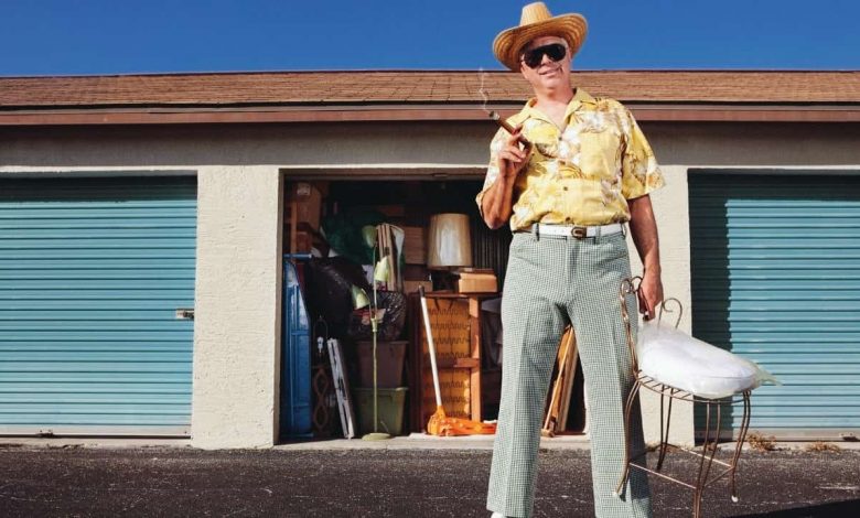 a man standing in front of Storage Solutions