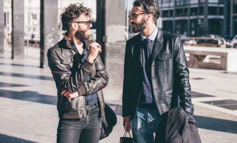 Fashionable guys talking to each other