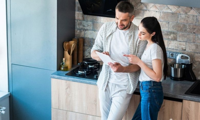 A couple using Technology to Make Home Life Easier