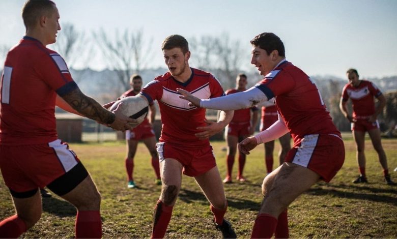 three students playing sports in college