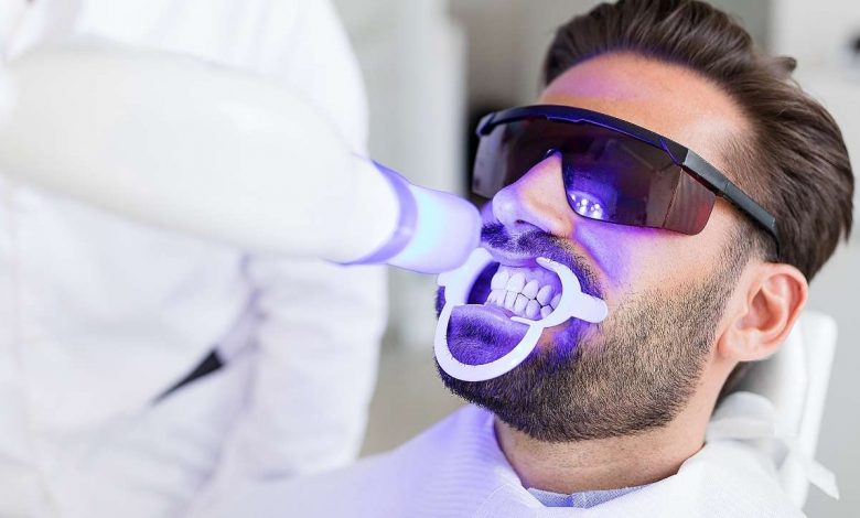A man getting Teeth Whitening procedure