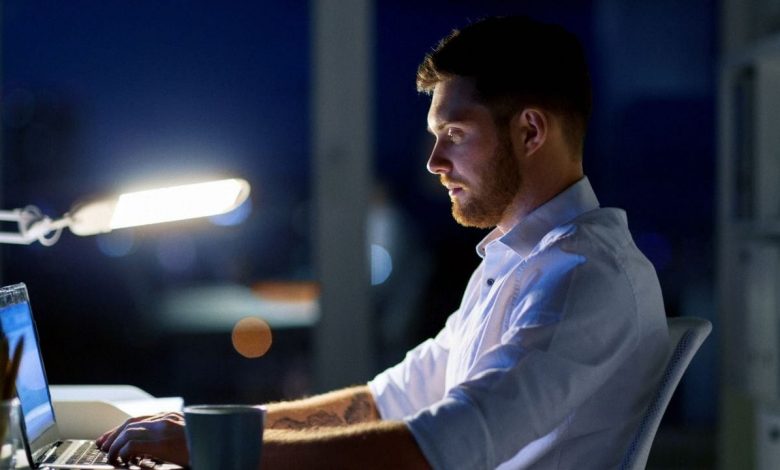 Entrepreneur working on laptop at night