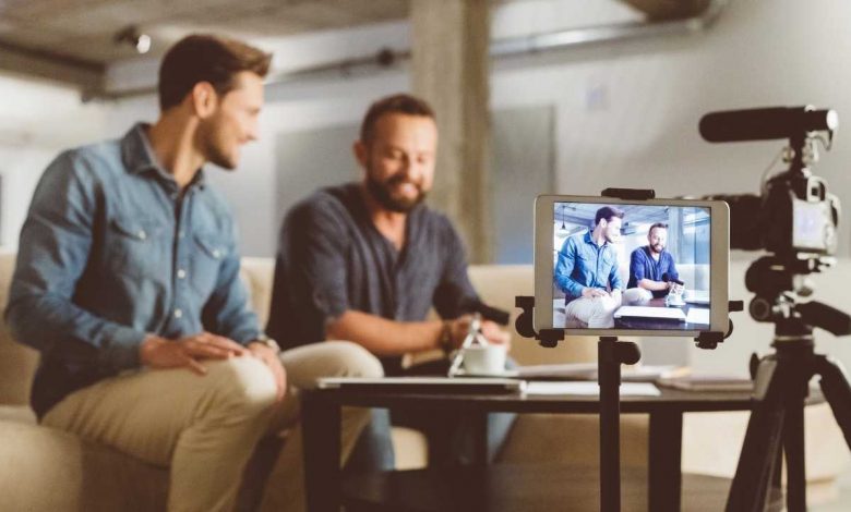 Men making video blog