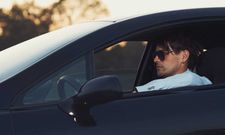 A guy driving his car