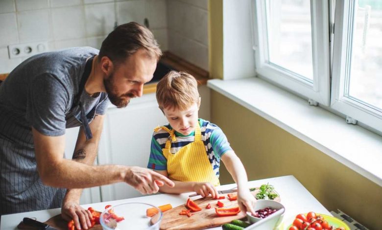 Father and son preparing food