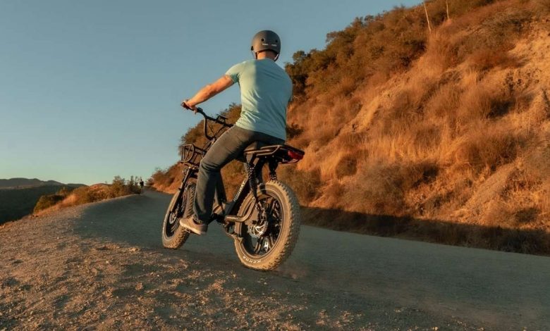 A man riding a e-bike