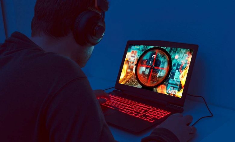 A guy using gaming laptop