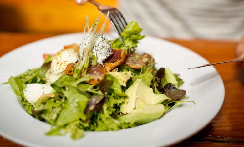 guy eating salad