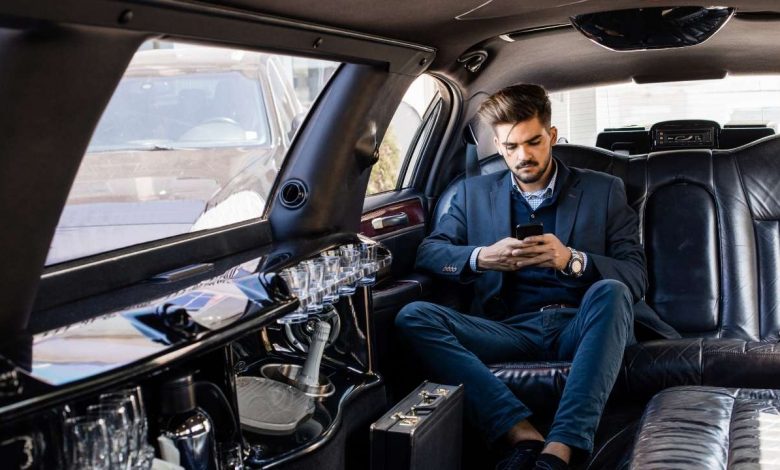 A guy sitting in a limo