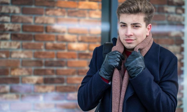 A guy standing outdoors during winters