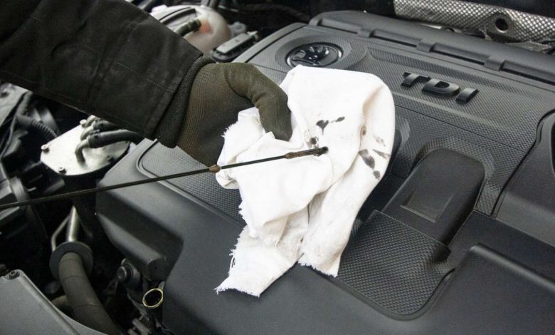 Checking oil level in car engine
