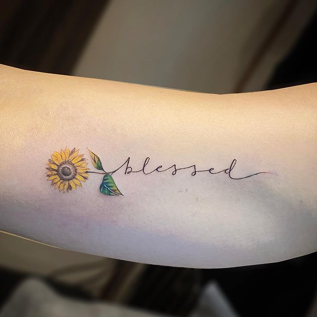 sunflower tattoo on forearm
