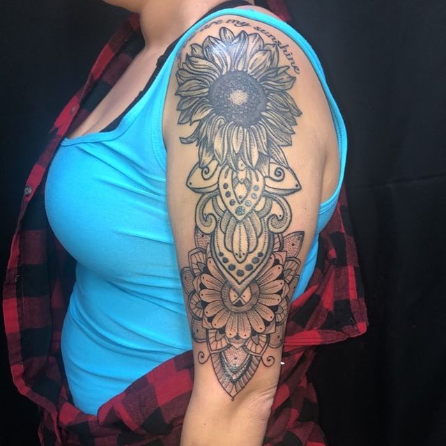sunflower tattoo on shoulder