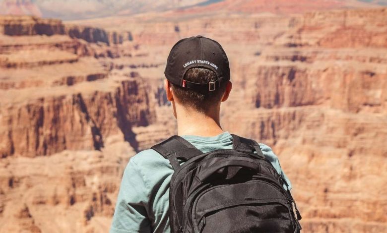 A guy standing at Grand Canyon