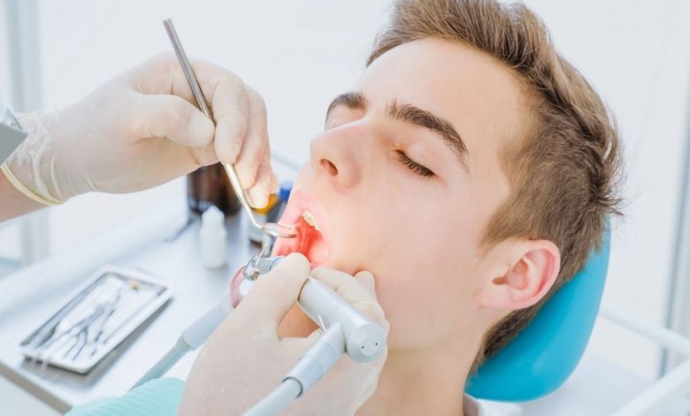 Guy undergoing root canal procedure