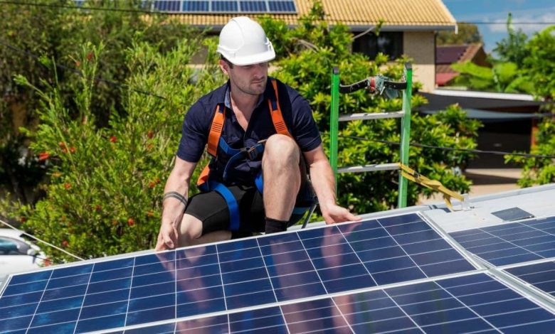 A guy working on solar panels