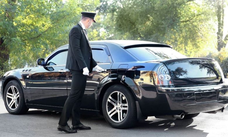 Chaffeur opening car door-min