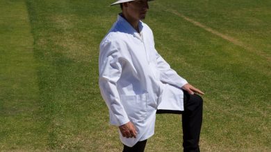 Cricket umpire giving leg bye