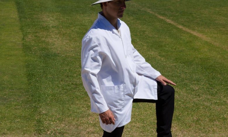 Cricket umpire giving leg bye