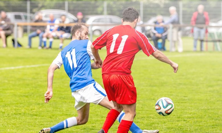 soccer player striking the ball