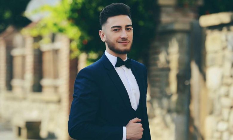 a guy wearing Bowtie with a suit