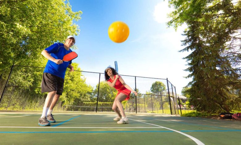 guy and girl playing Pickleball