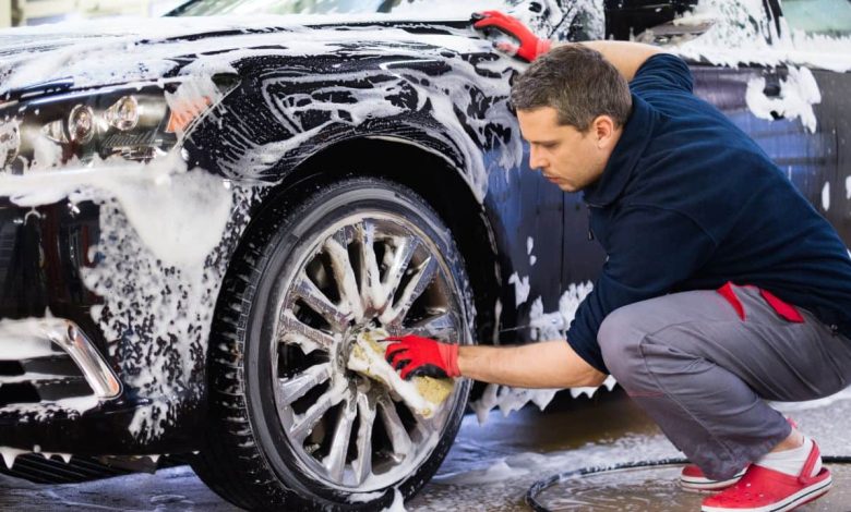 guy cleaning car