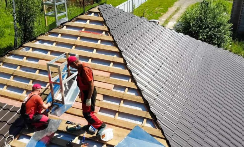 workers installing Roofing Materials