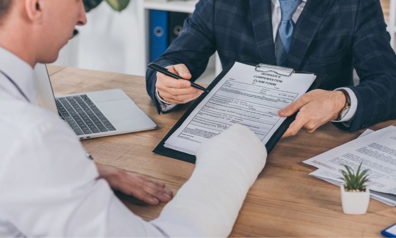 manager giving worker form for compensation for the injury worker had