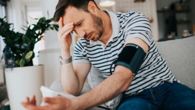 a guy checking his blood pressure