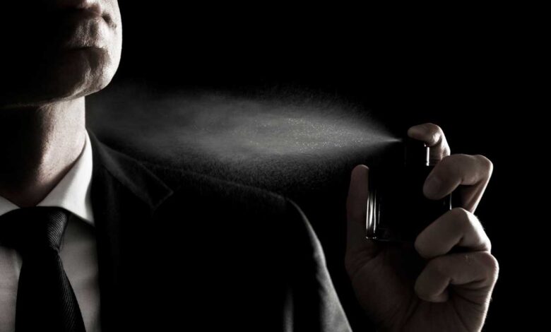 a guy applying Fragrance