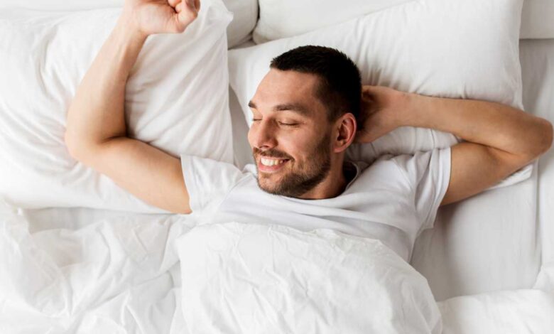 happy guy in bed