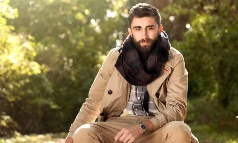 a man sitting outside during autumn