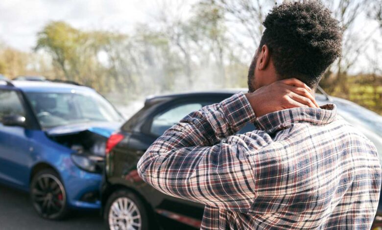 A guy seeing is car after accident