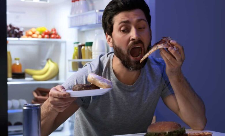 man eating junk food