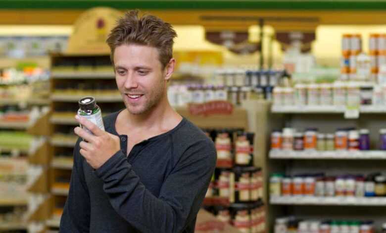a guy looking at a supplement