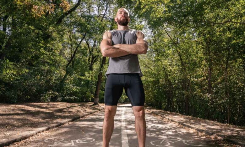 fit man in sportswear training outdoors