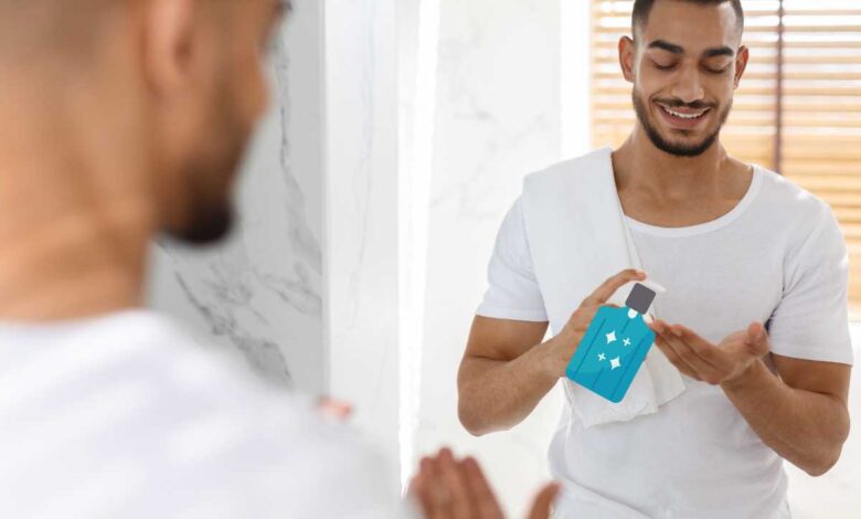 man applying aftershave