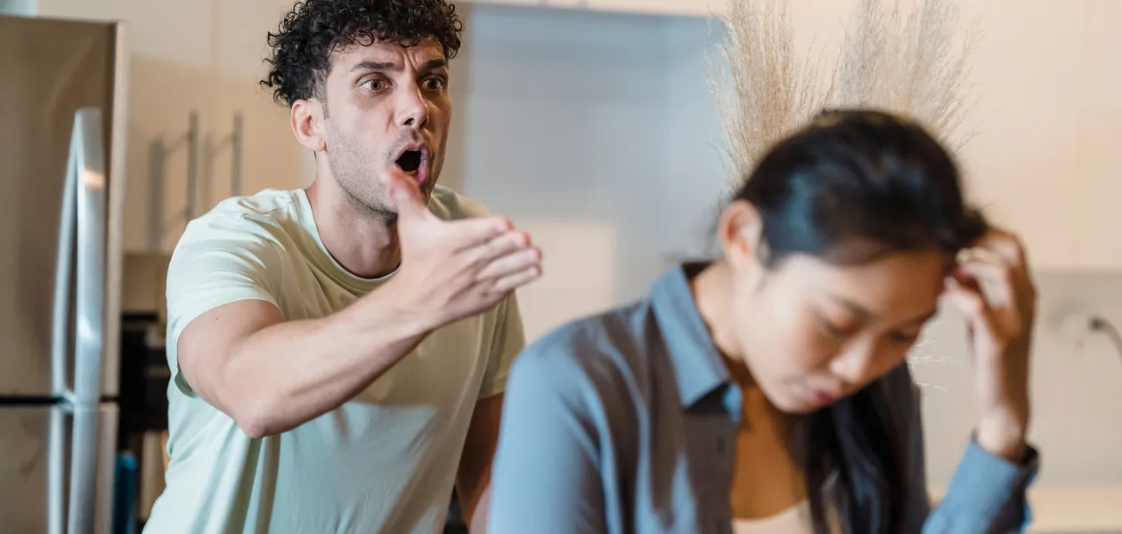 stressed couple arguing as a sign of anger issues in a relationship