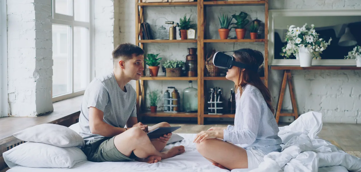 couple exploring a virtual world in vr at home