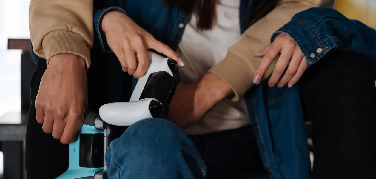 couple playing a co-op video game with controllers