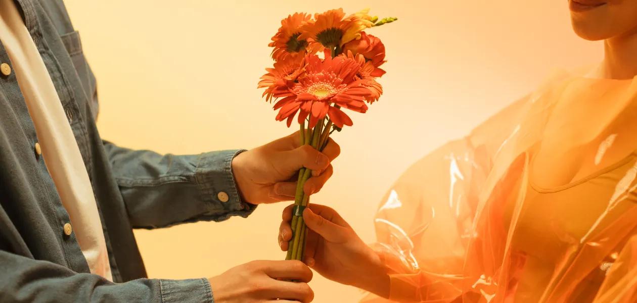 Partner receiving a bouquet of flowers, the receiving half of the exchange