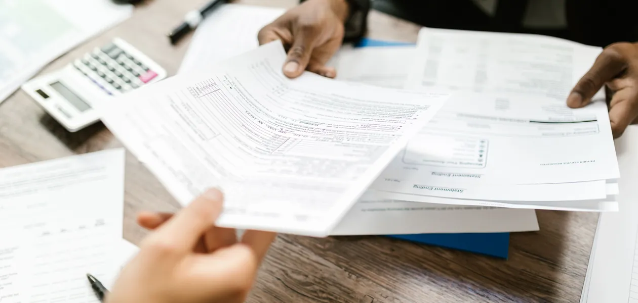 two people reviewing an insurance policy comparison