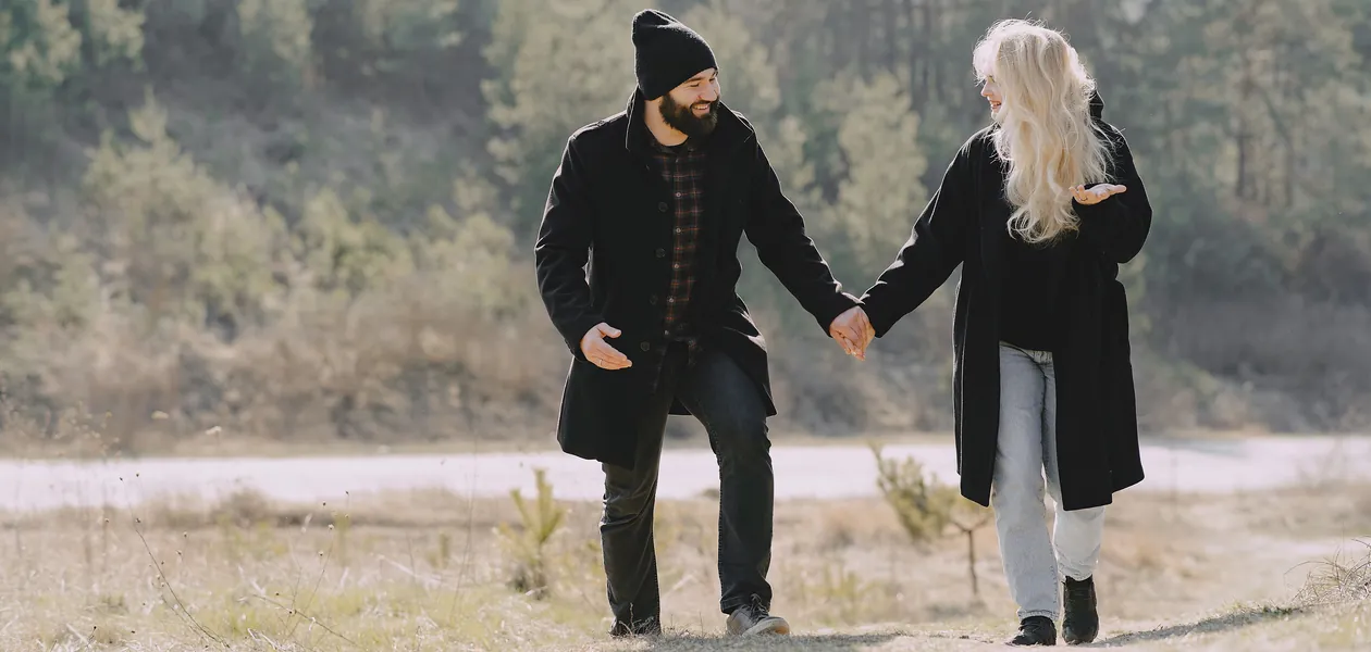 happy couple walking together in nature