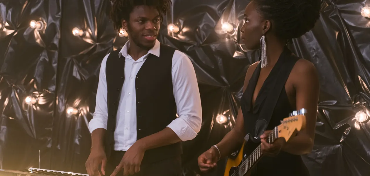 couple performing rnb duet with piano and guitar