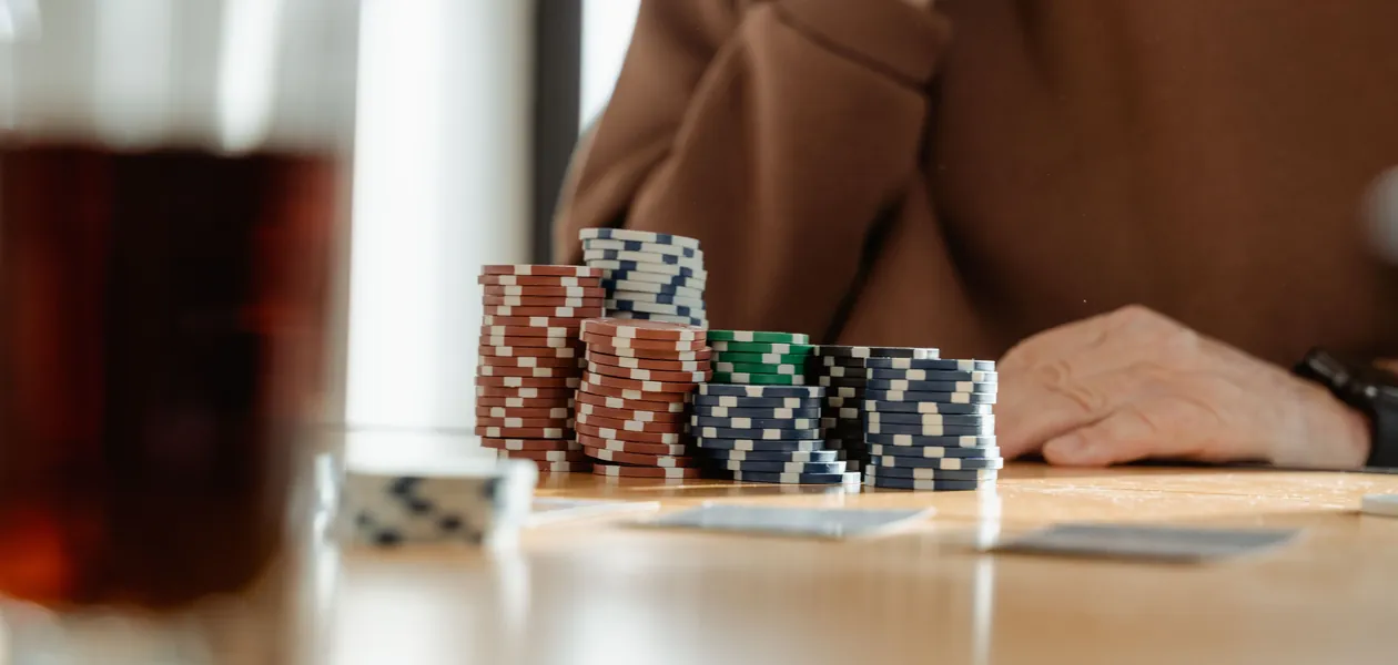poker chips and playing cards on a table