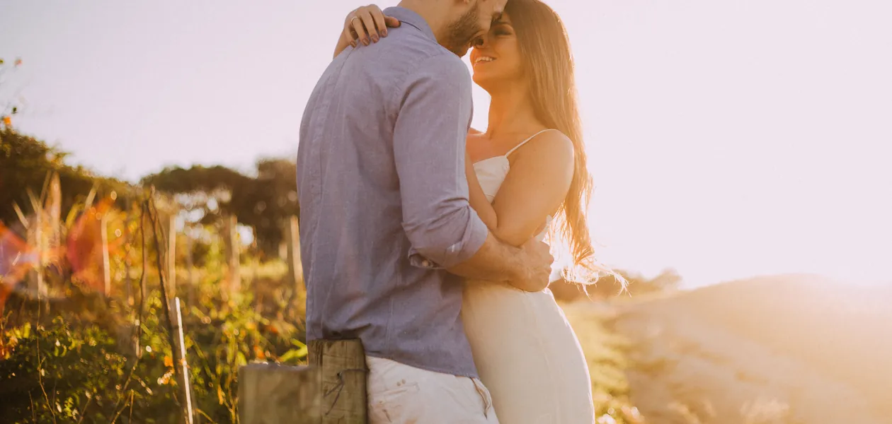 Romantic couple embracing at sunset
